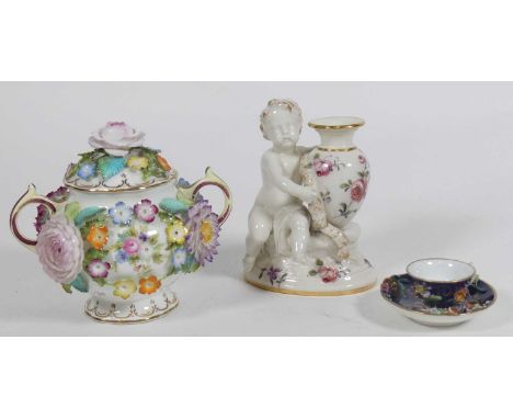 A Coalport flower encrusted twin handled pot and cover, together with a miniature cup and saucer and a Royal Worcester figure