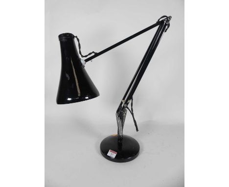 A black angle poise lamp