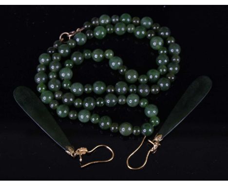 A beaded spinach jade necklace, 46cm; together with a pair of spinach jade ear pendants, on 18ct gold shepherd's crook fittin