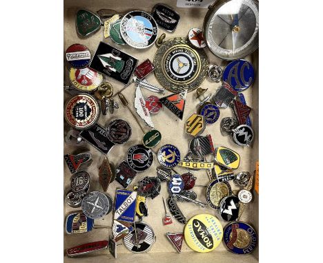 A collection of motoring badges to include Talbot, Oldham Batteries, Rudge, AC and Aston Martin Owners Club