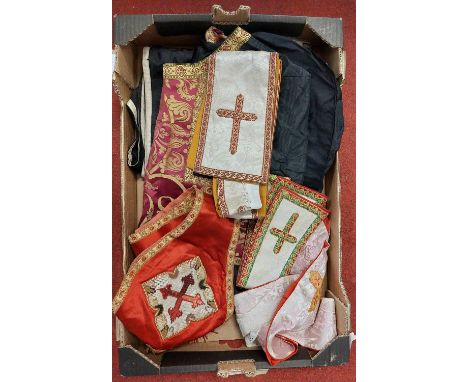 A collection of religious regalia to include a gown and sash