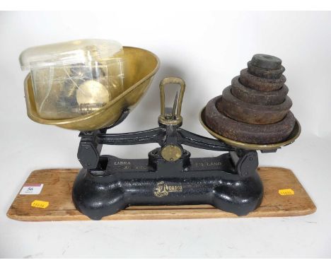 A set of Libra Scale Company weights &amp; scales on wooden base