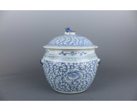 A Chinese blue and white ”scrolling lotus“ jar and cover, Qing Dynasty first half of the 19th century, the globular body pain
