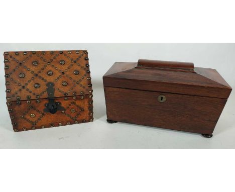 A mid 19th century rosewood tea caddy of sarcophagus shape, the hinged cover opening to reveal a fitted interior, width 30cm,