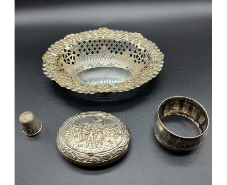 A silver plated pierced bonbon dish together with a pill box and a silver napkin ring and thimble (4)