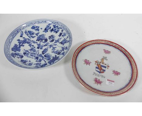 A Chinese porcelain armorial plate, bearing four character mark to the underside, dia. 27cm, together with a blue and white p