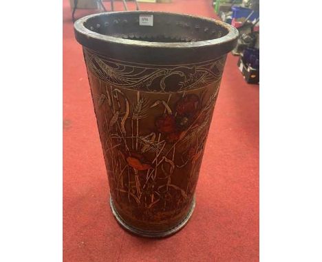 A leather umbrella stand, decorated with poppies