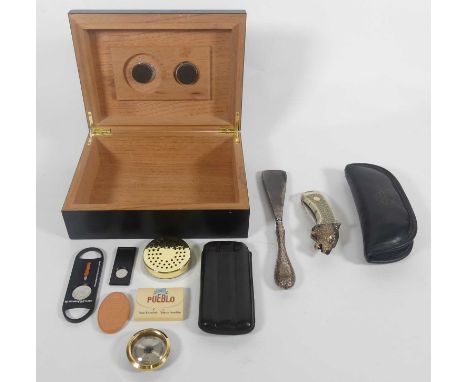 An ebonised cedar cigar humidor, w.24cm, together with various cutters and leather clad cigar case, Franklin Mint penknife in