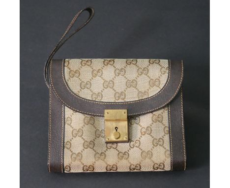 A vintage Gucci clutch handbag, marked Gucci, with dust bag and original key. H.16 W.19cm 