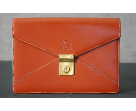 A Loewe clutch handbag in light tan leather with Loewe dustbag. H.18 W.26cm 