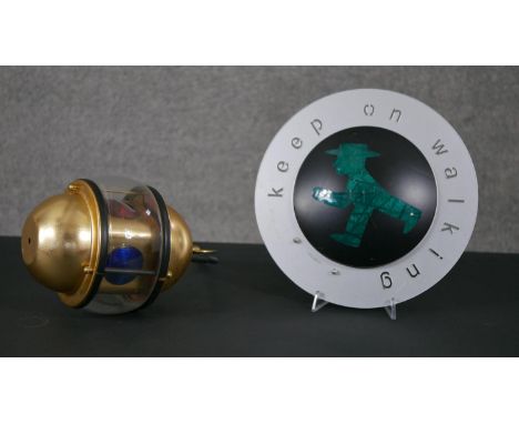 A keep on walking wall lamp by Oligo along with a traffic light and gilt metal hanging ceiling light.  Diam.30cm (largest) 