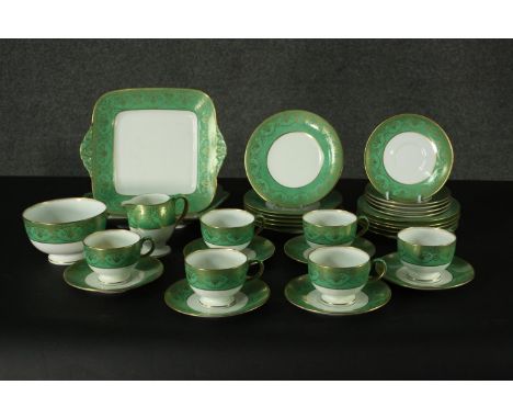 A vintage Wedgwood tea service to include six cups and saucers, matching plates etc, marked to underside. 