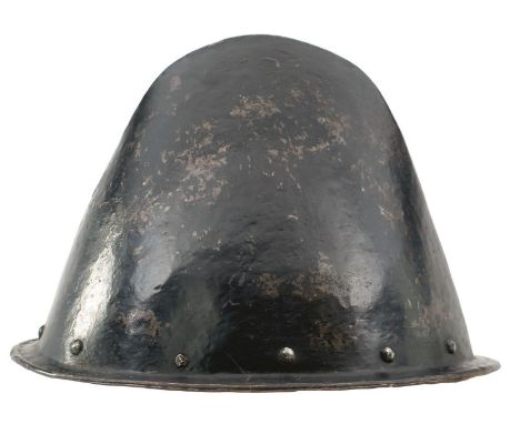 A 17TH CENTURY ITALIAN CABASSET, of characteristic hammered construction and of almond form, turned shallow brim, domed rivet