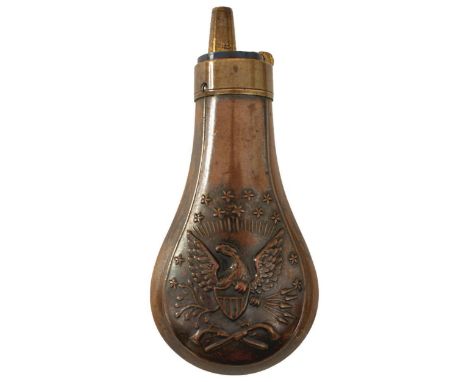 AN EMBOSSED COPPER POWDER FLASK, the lacquered copper body decorated with, stars, an eagle and shield above crossed revolvers