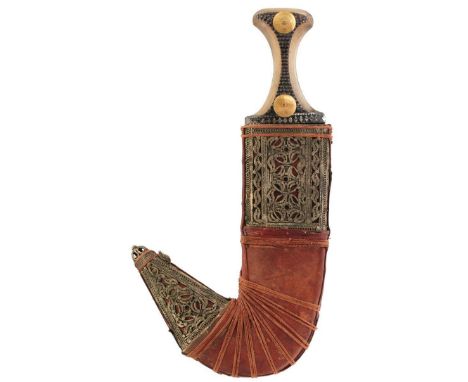 A LATE 19TH CENTURY YEMENI JAMBIYA, 22cm curved broad blade with raised medial ridge, characteristic horn hilt with white met