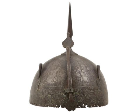 A LATE 18TH OR EARLY 19TH QAJAR KULA KHUD, characteristic single piece steel skull profusely decorated with courtly figures a