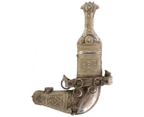 A 19TH CENTURY OMANI JAMBIYA, 17cm curved blade with raised medial ridge, characteristic white metal wrapped hilt profusely d