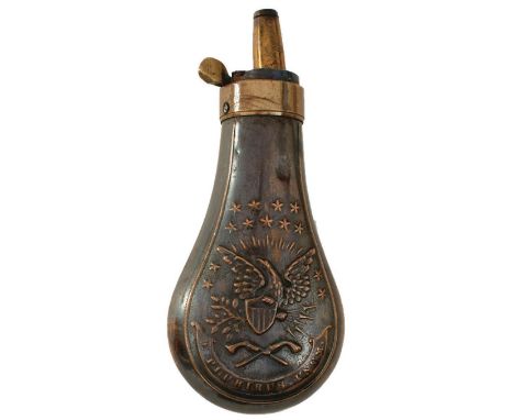 AN EMBOSSED COPPER POWDER FLASK, the lacquered copper body decorated with, stars, an eagle and shield above crossed revolvers