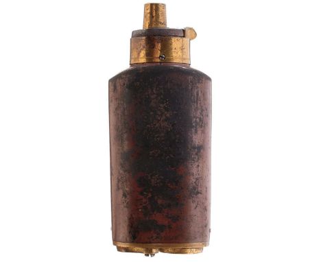 A THREE WAY PERCUSSION POWDER FLASK, sprung gilt top, lacquered copper body, gilt base with two pivoting covers. Dirt crust t