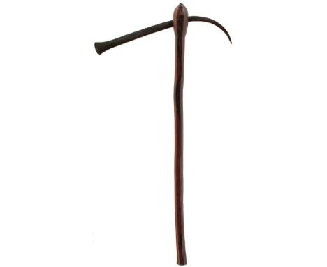 A 19TH CENTURY SHONA AXE, exaggerated down turned fluke, polished wooden haft, together with two further tribal axes. (3)