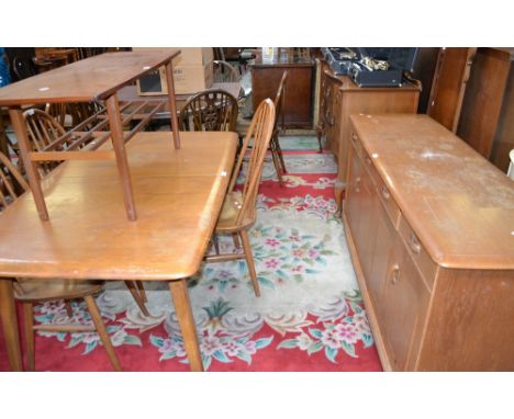 An Ercol style dining suite comprising extending dining table, four spindle back chairs, sideboard; a Nathan furniture coffee
