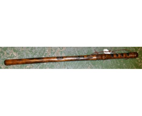 A Folk Art walking cane or baton, the shaft carved in relief with naval and military motifs, bayonet, sword, anchor, laurel b