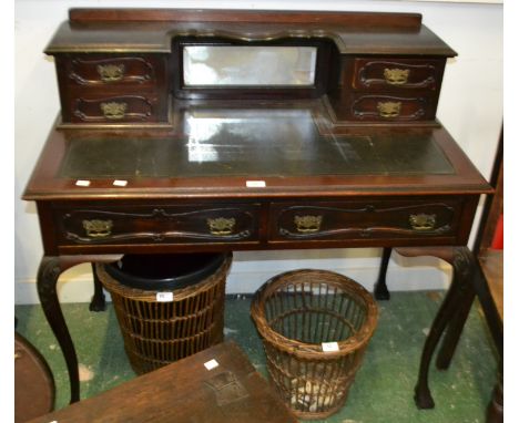 A late Victorian mahogany writing table, four drawers, shelf and mirror to superstructure, leather inlaid top, two drawers to