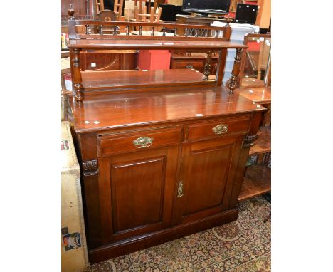 A late Victorian mahogany chiffonier, spindled gallery, turned supports to shelf, mirror back, moulded oversailing top, two s