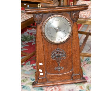 An early 20th century wall barometer, carved Art Nouveau style oak case, 61cm 