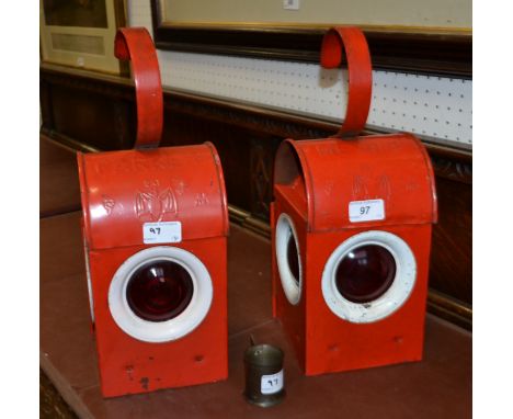 A red-windowed Railway emergency lantern, MEWWB, BS3143 complete with paraffin burner; another similar Parker emergency lante