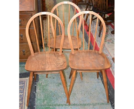 Three Ercol hoop back light elm dining chairs 