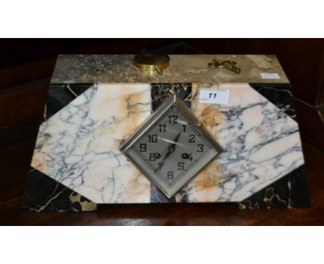 An Art Deco mantel clock with marble front, key and pendulum