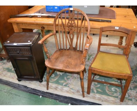 An Art Deco oak music chair; a Windsor elbow chair; an oak bedside cabinet (3)