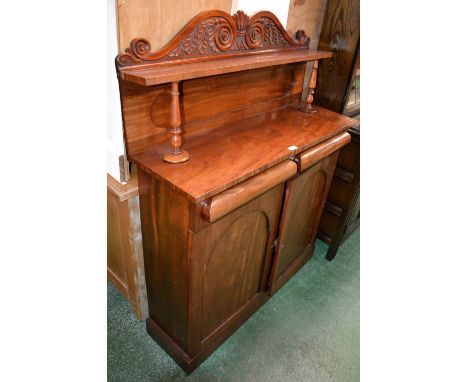 A Victorian mahogany chiffonier, scrolling arched pediment and shelf to superstructure, two drawers over two arched panel doo