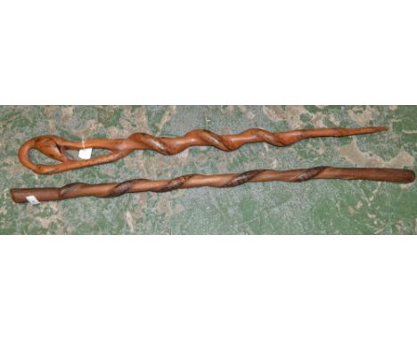 Tribal Art - an African staff or walking cane, carved as a stylised snake, 97cm long; another (2)