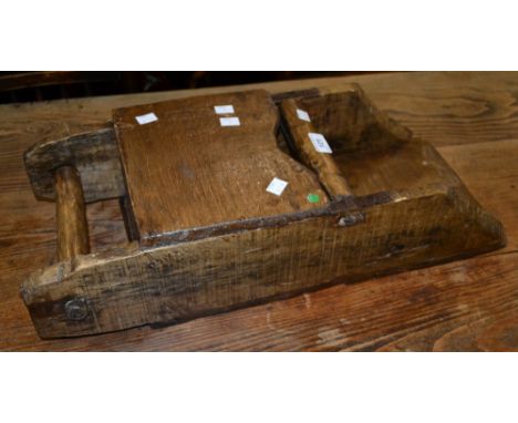 A vintage rustic grain scoop.