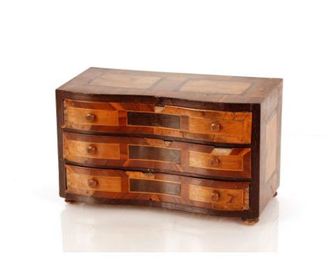 A 19th Century miniature Italian commode,&nbsp;of serpentine shape fitted three drawers, 29.5cm wide x 17cm high x 15cn deep