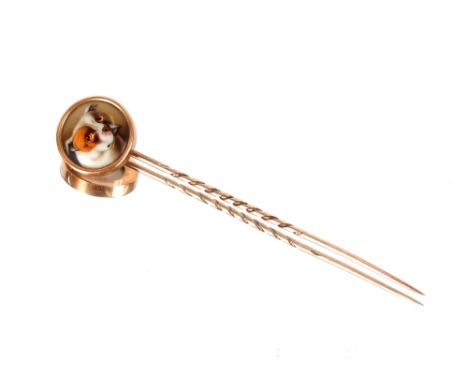 A Victorian yellow metal and enamel decorated stick pin,&nbsp;the terminal inset with a bull dog, signed verso W.Essex 1862, 