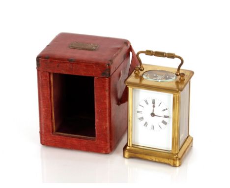 A brass cased&nbsp;carriage timepiece,&nbsp;having white enamel Roman numeral dial, leather travelling case, complete with ke