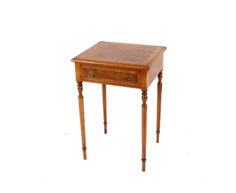 A pair of walnut and herringbone cross banded lamp tables,&nbsp;fitted single drawers raised on rounded tapering supports ter