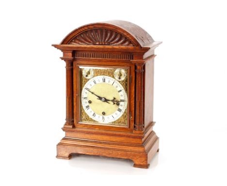 A late Victorian oak cased bracket clock,&nbsp;with brass spandrel dial and silvered chapter ring, chiming movement, 44cm hig