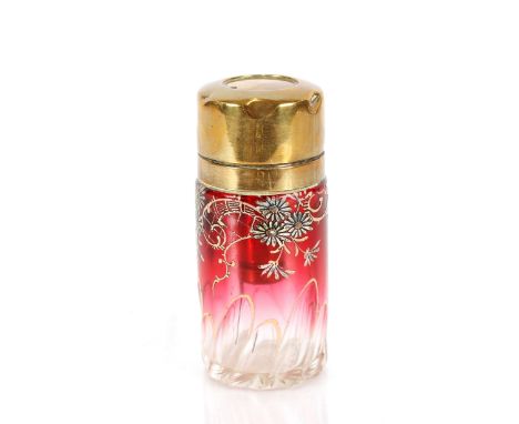 An unusual late Victorian ruby tinted glass scent bottle,&nbsp;with floral enamel decoration and brass mounts, the stopper im