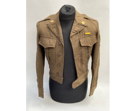 A 1940’s US Army OD wool field jacket, 34R, Technician, Army Service Forces, some holes to collar. Bernard 'Bernie' Harper Co