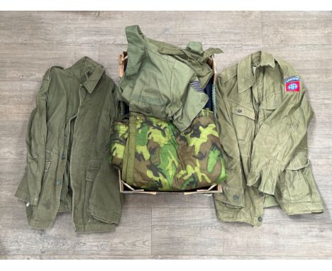 A box of uniform and kit including 1964 dated jacket overall and 1960 pattern smock combat size 1, 6070/8595
