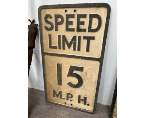 A vintage 'SPEED LIMIT 15 MPH' cast metal sign, thought to be ex military base