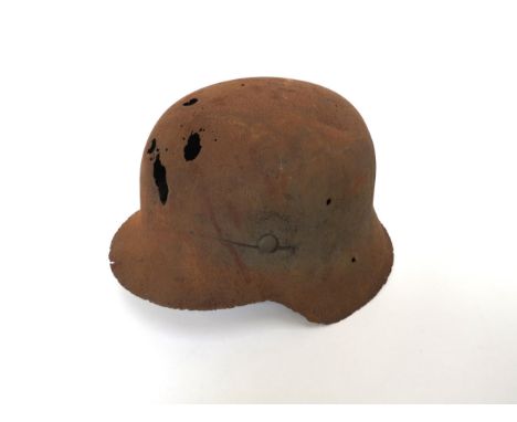 A Third Reich era German relic M42 helmet with some of liner intact, presumed to be a battlefield find