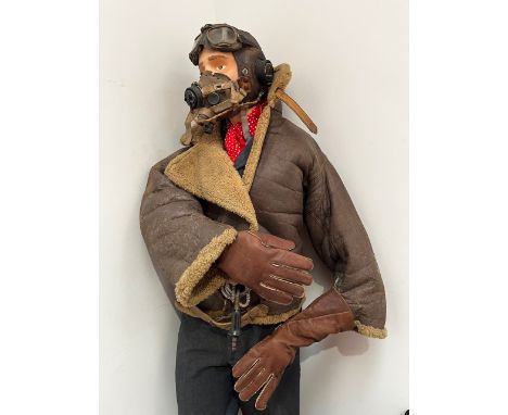 A WWII and later RAF pilot's outfit consisting of C-Type helmet, G-type mask, wartime Irvin flying jacket and post-war unifor