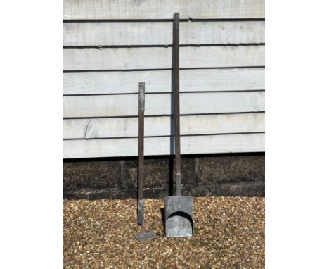 A WWII British Civil Defence Home Front incendiary bomb clearing set consisting of scoop and hoe, both mounted on poles which