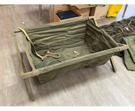A military canvas sink, folding wooden frame, together with a water carrier (2)