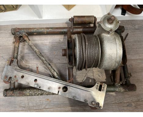 An aircraft bomb hoist thought to be from a Consolidated B-24 Liberator bomber, together with a Type B7 bomb shackle / rack, 